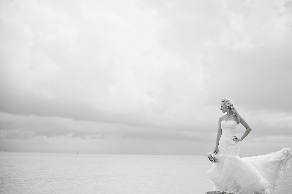bride looking out at the ocean during hurricane season
